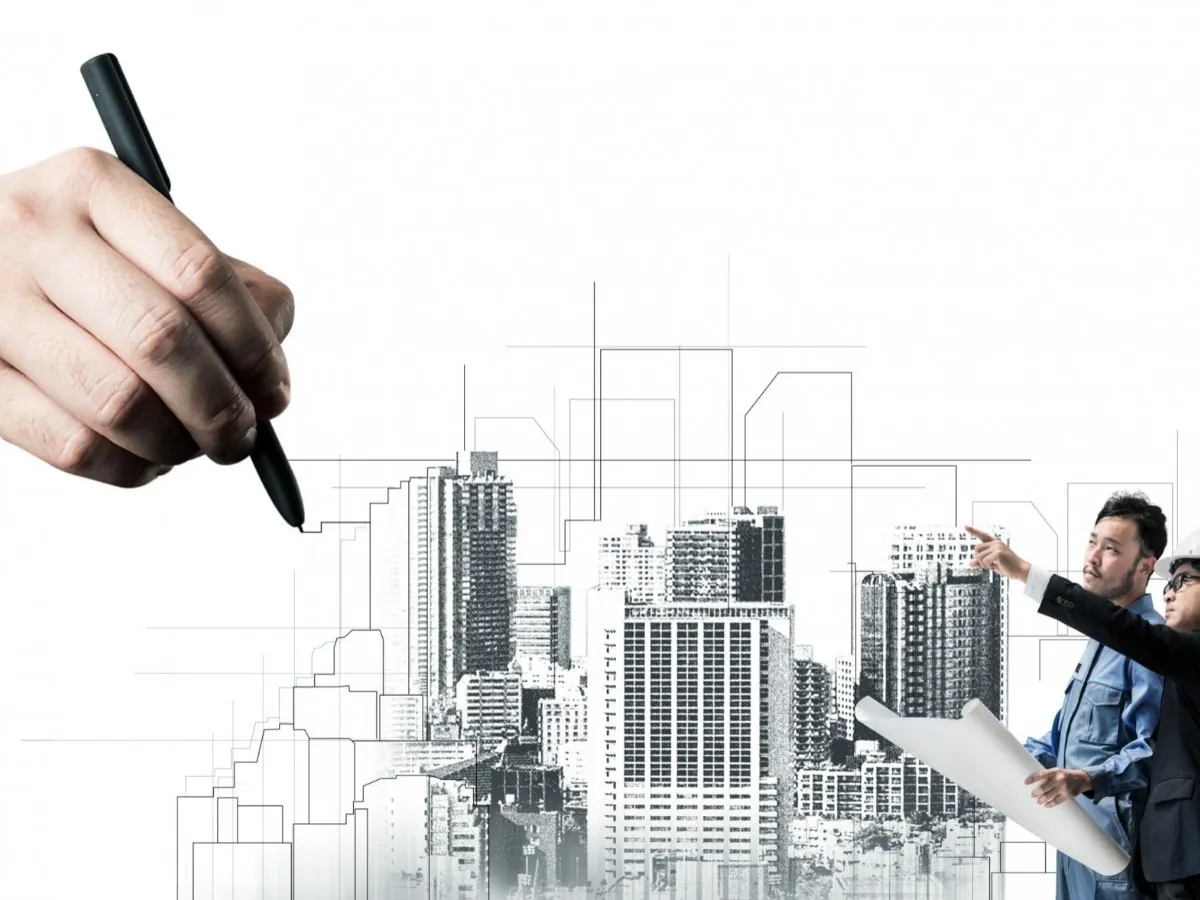 Engineers reviewing plans against a sketch of a redeveloped skyline
