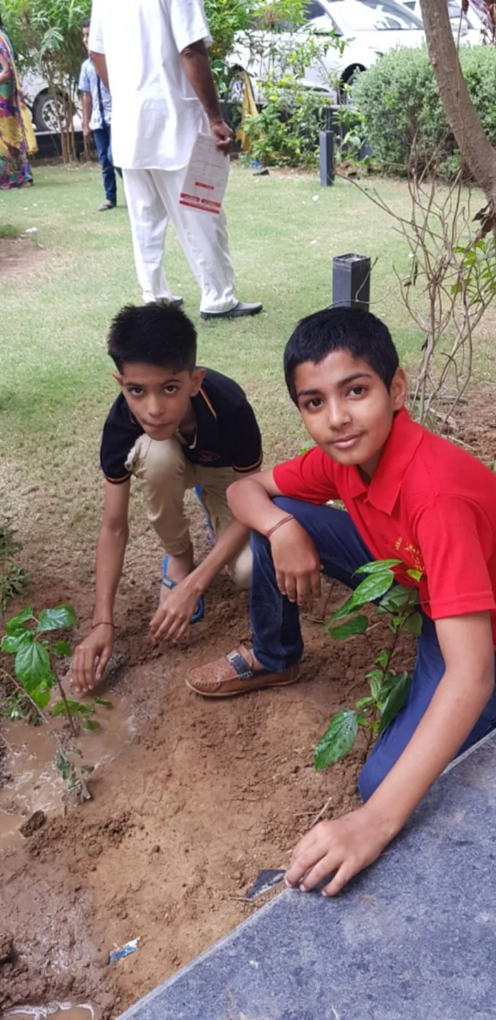 Young residents planting saplings at an NB Seva Foundation drive