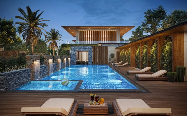 The clubhouse pool lit at night